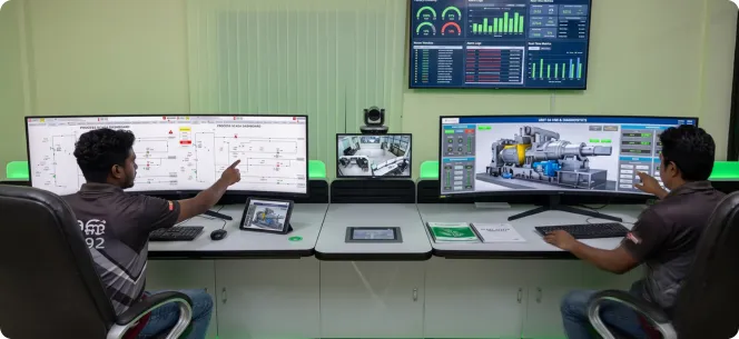 Engineer reviewing SCADA turbine control screens on a laptop