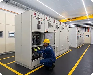 Engineer testing a switchgear panel in the test bay